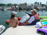 Lake Martin&nbsp;Holding onto jet ski engrossed in coversation enjoying the concert